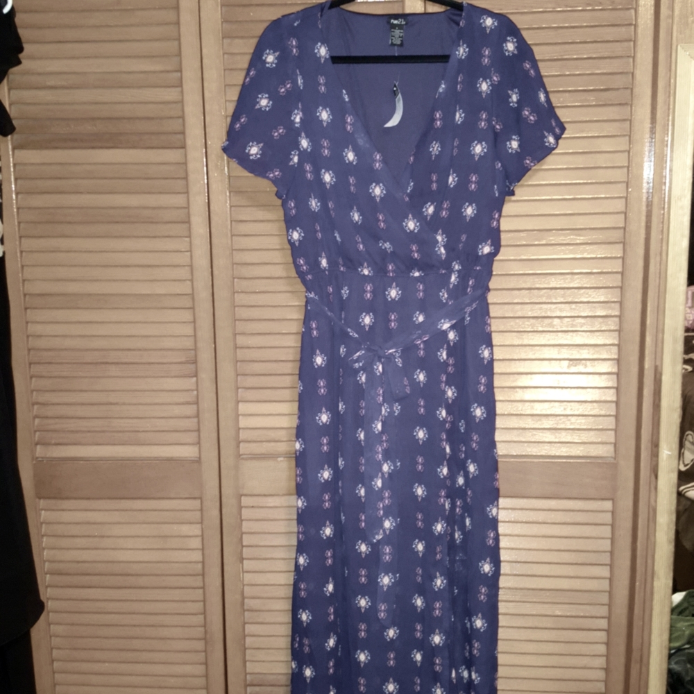 Never been worn dress. Short skirt inside since see through material